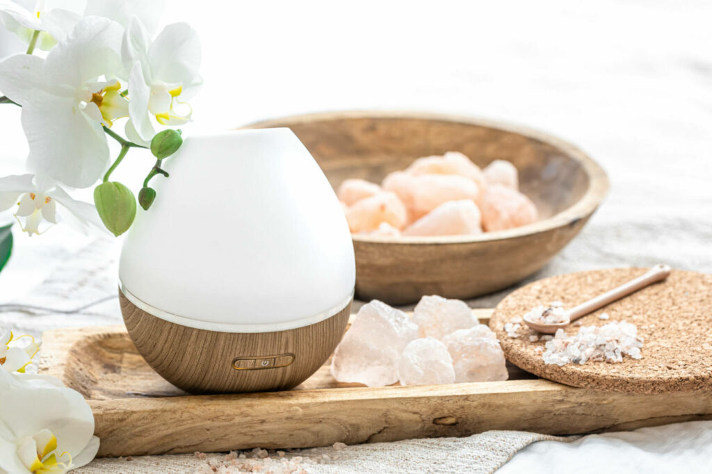 Modern oil aroma diffuser close up on a blurred background.